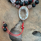 Onyx, Mediterranean Coral and Om Mani Padme Hum Mala with Clear Quartz Guru Bead