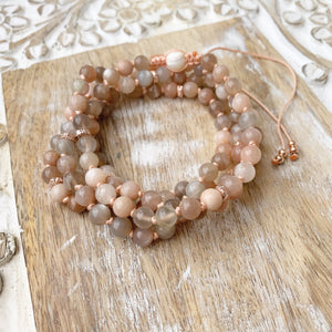 Sunstone Adjustable Mala with White Shells Guru Bead